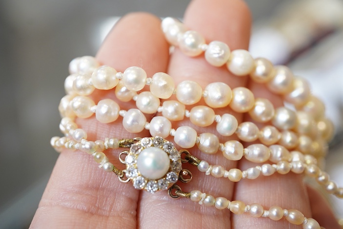 A natural pearl and diamond necklace, early 20th century